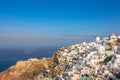 Windmills and White Houses on a Mountainside in Oia Town Royalty Free Stock Photo