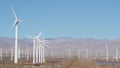 Windmills on wind farm, wind mill energy generators. Desert windfarm power plant Royalty Free Stock Photo