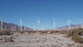 Windmills on wind farm, wind mill energy generators. Desert windfarm, USA. Royalty Free Stock Photo