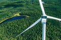 Windmills, wind turbines. Aerial view of windmills in green summer forest in Finland Royalty Free Stock Photo