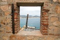 Window at abandoned brick and stone building on hill above Cabo San Lucas marina and harbor in Baja California Mexico Royalty Free Stock Photo