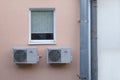 Window with air conditioning and drainpipes. Close-up Royalty Free Stock Photo