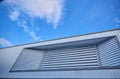 Window of metal sheet building with vivid blue sky Royalty Free Stock Photo