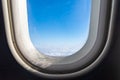 The window of the airplane. A view of porthole window on board an airbus for your travel concept or passenger air transportation Royalty Free Stock Photo