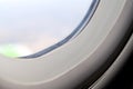 The window of the airplane. A view of porthole window on board an airbus for your travel concept or passenger air transportation Royalty Free Stock Photo