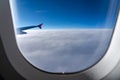 The window of the airplane. A view of porthole window on board an airbus for your travel concept Royalty Free Stock Photo