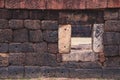 Window on ancient laterite wall in historical park