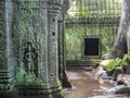 Window on the ancient wall and dancing apsara; ruins and old bas-relief, Angkor Wat temple, Siem Reap, Cambodia Royalty Free Stock Photo