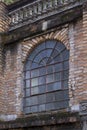 Old window and apparent brick wall