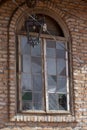 Old window and apparent brick wall