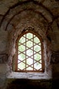 a window in a castle with stone walls Royalty Free Stock Photo