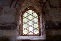 a window in a castle with stone walls and bars Royalty Free Stock Photo