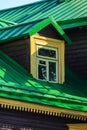 Window on the Attic Floor. Green Seam Roof Royalty Free Stock Photo