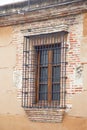 Window with bars on a brick wall. Royalty Free Stock Photo