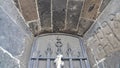 A window with bars on the Old castle from the outside