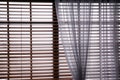 Window with beautiful curtain and blinds, closeup