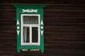 Window with beautiful fretted wooden case . It`s a traditional decoration of old russian wooden houses.