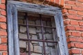 Window behind bars in an old house1 Royalty Free Stock Photo