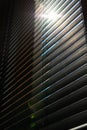 Window blinds or jalousies with direct sunlight. Interior design concept photo