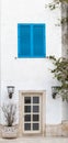 A window with blue shutters and door Royalty Free Stock Photo