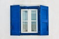 Window with blue shutters in Mykonos