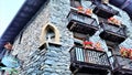 Window Boxes in Medieval Stone Building in Dolonne