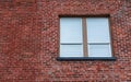 Window in Brick Wall. Window with closed blinds in a urban red bricks clinker house Royalty Free Stock Photo