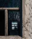 Window of a building surrounded by the cracks of the wall