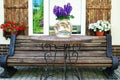 Window with carved doors and with flower pots on the facade of t Royalty Free Stock Photo