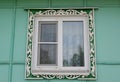 Window with carved platbands. Russia Royalty Free Stock Photo
