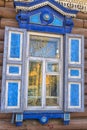 Window with carving architraves and closed shutters. Royalty Free Stock Photo