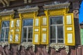 Window with carving architraves and closed shutters.