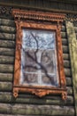 Window with carving architraves and closed shutters. Royalty Free Stock Photo