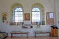 Window of a church. The interior of a small provincial church, the interior decoration. Icons, prayers. Russia