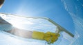 Window cleaner cleaning window with squeegee and wiper on a sunny day Royalty Free Stock Photo