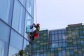Window cleaner on high-rise buildings. Industrial climber