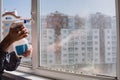 Window cleaner using a squeegee to wash a window. Cleaning windows using cleaning products