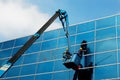 Window cleaner at work, design architecture Royalty Free Stock Photo