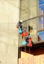 Window cleaners working in an office building Royalty Free Stock Photo