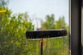 Window cleaning using telescopic water brush and wash system Royalty Free Stock Photo