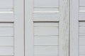 Window with closed beige wooden shutters