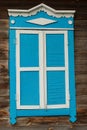 The window with closed shutters is blue in the color of an old village house Royalty Free Stock Photo