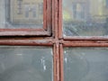 Red Gothic style cross. Christian cross in the window. Abstract cross in church interior Royalty Free Stock Photo