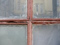 Red Gothic style cross. Christian cross in the window. Abstract cross in church interior Royalty Free Stock Photo