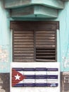 WINDOW AND CUBAN FLAG, HAVANA, CUBA Royalty Free Stock Photo