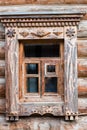 A window decorated with carvings. old log house. retro-style. Museum Royalty Free Stock Photo