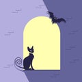 Window is decorated for Halloween with a black cat and a bat Royalty Free Stock Photo