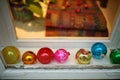 Window decorated by a variety vintage retro Christmas baubles