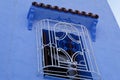 Window with decorative grill in Chefchaouen town, Morocco Royalty Free Stock Photo