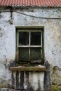 Window of dilapidated house in rotten frame Royalty Free Stock Photo